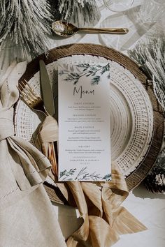 a table setting with napkins, silverware and place settings for an elegant dinner