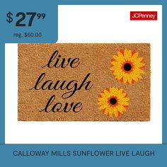 a door mat with two sunflowers on it and the words live laugh love