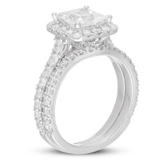 a white gold engagement ring with two rows of diamonds