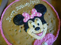 a birthday cake with a minnie mouse face on it