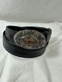 "You are looking at genuine lizard belt with sterling silver buckle. Belt measures 37\"72 long with 29\"4 from the first perforation and 34\"4 at its last perforation from buckle and 1\"1 width. The front buckle measures approximately 2\"7 x 1\"6 and has lovely patina. The lizard belt and buckle is a great vintage find and will last you for years to come.  Shipping Shipping is done with USPS priority mail within the U.S. and shipping takes 4-5 business days from the date of payment. Please note I do combine shipping for multiple items." Formal Adjustable Concho Belt, Vintage Silver Leather Belt Buckles, Western Engraved Belt For Formal Occasions, Western Style Engraved Belt For Formal Occasions, Vintage Adjustable Belt Buckles For Formal Wear, Formal Adjustable Engraved Belt, Vintage Concho Belt Buckles, Western Silver Belt With Antique Buckle, Vintage Concho Belt Buckles For Formal Wear