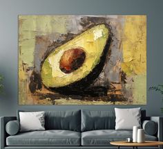 an avocado painting on the wall above a couch