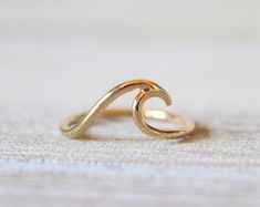 Discover Anniversary ring | Etsy Gold Wavy Rings For Gifts, Wavy Gold Rings For Gift, Ocean-inspired 14k Gold Jewelry, Gold Wavy Promise Ring, Gold Wavy Rings For Anniversary, Minimalist Wavy Yellow Gold Jewelry, Wavy 14k Gold Rings, Yellow Gold Wavy Jewelry With Polished Finish, Minimalist 14k Gold Wavy Jewelry