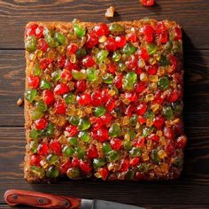 a piece of cake with gummy bears on it next to a pair of scissors