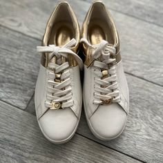 Nwt! Michael Kors" White/Gld Sneakers! Size 6 1/2 .. True To Size ! Comes In New Box Brand New ! Does Have Small Blemish Mark As Shown That’s The Only Flaw It’s Small So Not Noticeable Gold Leather Sneakers With Laces, Gold Lace-up Sneakers With Metallic Logo, Gold Low-top Sneakers With Metallic Logo, Gold Leather Sneakers, Gold Low-top Sneakers With Laces, Casual Gold Sneakers With Metallic Logo, Gold Casual Sneakers With Metallic Logo, Gold Sneakers With Foil Embossed Logo And Round Toe, Gold Sneakers With Round Toe And Laces