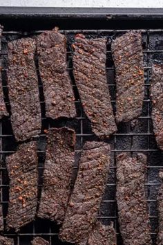 grilled steaks on a grill with seasoning