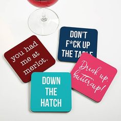 four coasters with different sayings on them