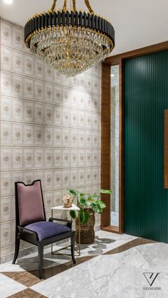 a room with a chandelier, chair and potted plant