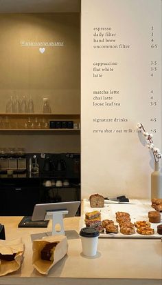 there is a table with food and drinks on it in front of the counter top