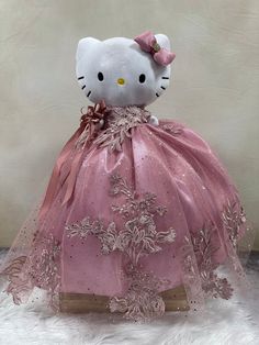 a hello kitty doll in a pink dress