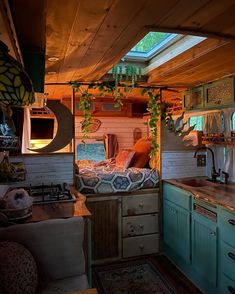 the interior of a small home with wood paneling and green cabinets, including an oven