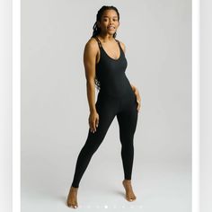 Brand New, Never Worn Black Athleisure Jumpsuit With Built-in Bra, Black Athleisure Jumpsuits And Rompers With Built-in Bra, Sleeveless Black Unitard For Loungewear, Chic Black Jumpsuits And Rompers For Workout, Chic Black Workout Jumpsuits And Rompers, Slouchy Jumpsuit, Loungewear Chic, Coral Jumpsuit, Lounge Jumpsuit