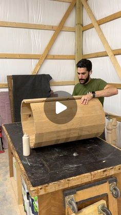 a man is working on a wooden object