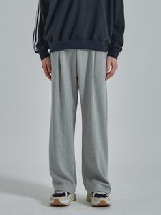 It is a wide sweatpant made of cotton and polyester blend fabric that is suitable for every season except winter. The pant has pleats from the waist, and it gets wider to the hem. It is finished with tumble and tenter process to minimize fabric shrinking or twist after wash. The pant is finished with track stitch.- Elastic band waist- Side pockets- Back pocket- Drawstring on the waist Winter Solid Color Wide-leg Sweatpants, Loosely Fitted Wide-leg Sweatpants For Winter, Winter Wide-leg Sweatpants With Elastic Waistband, Cotton Sweatpants For Winter, Cotton Wide-leg Pants With Ribbed Cuffs, Cotton Wide Leg Pants With Ribbed Cuffs, Winter Cotton Full-length Sweatpants, Winter Cotton Full Length Sweatpants, Gray Cotton Wide-leg Sweatpants