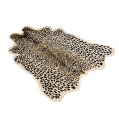 an animal print rug with spots on it