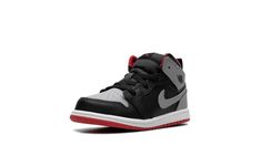 The Air Jordan 1 Mid TD “Black/Cement Grey” is the toddler sizing of the lifestyle shoe with a neutral-colored look.  The “Black/Cement Grey” Jordan 1 Mid TD features a Cement Grey leather on the perforated toe, collar, and heel, and black leather on the toe cap, forefoot, eyelets, and mid-panel.  A Cement Grey leather Swoosh appears on both sides, and a “Wings” logo is found on the collar.  A Fire Red Jumpman is located on the tongue tag, while a pull tab on the heel assists with on/off wearabi Jordan 1 Mid Black, Grey Jordans, White Jordans, White Cement, Black Cement, Cement Gray, Wings Logo, Black Fire, Stadium Goods