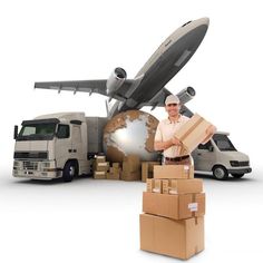 a man standing in front of boxes and a truck with a plane on the back