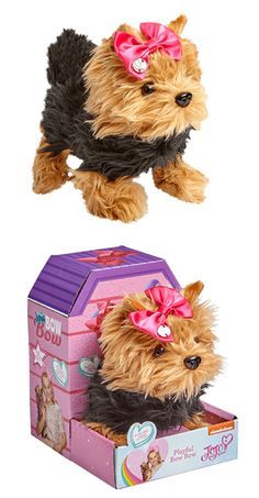 a small dog in a pink bow on top of a box