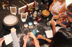 a group of people standing around a table