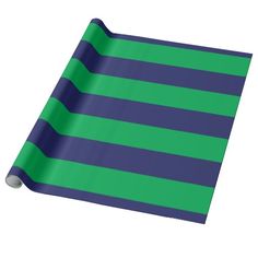 a roll of blue and green striped paper on a white background with an image of stripes