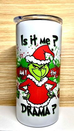 the grinch is it me? i am the drma? canister with santa claus on it