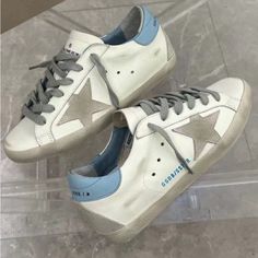 Light Blue/White Casual Blue Custom Sneakers With Leather Sole, Blue Sneakers With Leather Sole For Streetwear, Light Blue Leather Sneakers For Spring, Goose Shoes, Golden Goose Shoes, Golden Goose, Mens Shoes Sneakers, White Blue, Men's Shoes