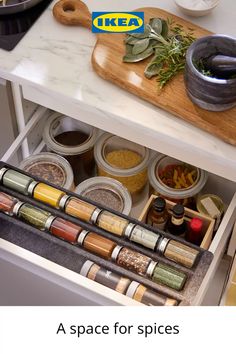 an open drawer with spices and seasonings in it