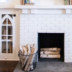 the fireplace is clean and ready to be used for decorating with firewood logs