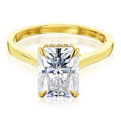 a yellow gold engagement ring with a princess cut diamond