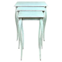 three nesting tables with one sitting on top of the other, all in light blue