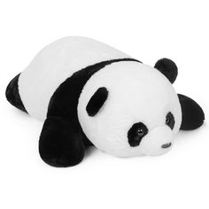 a stuffed panda bear laying down on the ground