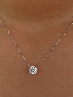 This Beautiful timeless floating prong set diamond pendant is set with 3-carat lab-grown diamond in 14k solid gold. It will be the classic perfect gift for any woman in your life--whether she's your wife, girlfriend, fiancée, or bride. The pendant and chain are made of 14k solid gold and feature a spring clasp. The necklace is available for purchase with or without an IGI certificate. All of our diamonds are high-quality D color, VS1 clarity. Each diamond is securely set in a Prong setting, radiating sophistication with every glance. Every diamond is expertly positioned to reflect maximum light and brilliance that tells your forever love story. Item Details: 14k solid gold pendant and chain Chain length: 16 inches up to 18 inch Diamond: CVD lab-grown diamonds  Total Weight :3 carats Cut: R Luxury Refined Solitaire Necklace With Brilliant Cut, Luxury Dazzling Diamond Necklace With Prong Setting, Luxury Cushion Cut Necklace With Prong Setting, Diamond Solitaire Pendant Jewelry, Lab Grown Diamond Pendant With Single Diamond, Solitaire Pendant Necklace With Lab Grown Diamond, Solitaire Pendant Necklace With Lab-grown Diamond, Solitaire Lab Grown Diamond Round Pendant Jewelry, Lab-grown Diamond Solitaire Round Pendant Jewelry