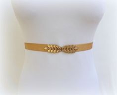 "This classic elastic waist belt with a gold grecian leaf clasp is the perfect finishing touch to upgrade every outfit. You can wear it on a dress, skirt, jumpsuit, pants or tunic. Comfortable and flattering to a woman's waistline. ❤ Sizes: XS Fits waists 25\"- 27\" (63- 68cm) Length end to end 24\" (60cm) S Fits waists 27\"- 29\" (68- 73cm) Length end to end 26\" (65cm) M Fits waists 29\"- 31\" (73- 78cm) Length end to end 28\" (70cm) L Fits waists 31\"- 33\" (78- 83cm) Length end to end 30\" ( Elegant Rope Belt For Spring, Adjustable Gold Fabric Belt, Gold Fitted Belt For Formal Occasions, Gold Fitted Belt, Formal Fitted Gold Belt, Gold Adjustable Belt For Spring, Adjustable Elegant Corset Belt, Elegant Adjustable Corset Belt, Adjustable Gold Belt For Summer