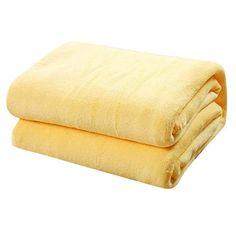 two yellow towels folded on top of each other