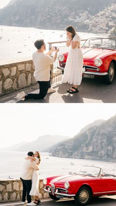 a man kneeling down next to a woman in front of a red car and another person taking a photo