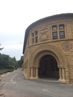 an old building with arched doorways on the side