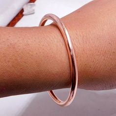 Weight of ring 25 Gm,  Bangle All Size Available 100% Pure Copper JEWELRY Dimensions Bangle Thickness : 4 Millimetres To get the correct size of bangle, see the picture and video of given size. i make jewelry for a very special kind of Women's men's ,This stunning is handcrafted by one of our talented artisans. It is set in precious Fine Jewelry 925 Sterling Silver Jewelry, Polished to a brilliant luster> You can also contact us for a separate order, or place an order? The necklaces made of copp Stackable Rose Gold Bangle For Wedding, Rose Gold Stackable Bangle For Wedding, Rose Gold Stackable Bangle As Gift, Rose Gold Hoop Bracelets For Gift, Rose Gold Copper Bangle Cuff Bracelet, Rose Gold Copper Bangle As Gift, Rose Gold Copper Cuff Bangle, Rose Gold Bangle For Gift, Elegant Rose Gold Copper Bangle