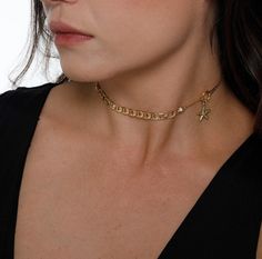 "♦ Unique and designed chain choker made of 2-micron gold plated brass, decorated with a small starfish on the side of the choker, very delicate and suitable for any appearance . You have A year warranty for the color. You can order this choker in sterling silver. SIZE: 13.8\"/30 cm up to 15\"(38cm) with an option to expand up to an additional 2.7\"/7 cm. Pendant height: 0.39\"(1cm) Width pendant: 0.39\"(1cm) Width chain: 0.24\" (0.6CM) ♦ This piece of jewelry is perfect as a gift for yourself, Dainty Gold Chain Choker, Metal Choker Charm Necklaces With Delicate Chain, Trendy Figaro Chain Choker, Dainty Beach Choker Necklace, Gold Plated Figaro Chain Choker, Gold Chain Metal Charm Choker Necklace, Star Charm Choker Necklace For Gifts, Gold-plated Figaro Chain Choker, Star Charm Choker