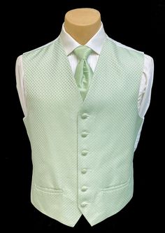 Men's Green Tuxedo Vest & Tie This is a handsome tuxedo vest from our rental stock.  The After Six design features a six button front and is tailored in a machine washable polyester with a pattern. The matching tie is pre-tied with an adjustable neck.  The vest is adjustable in the rear with an elastic band above the waist.  The back of this vest is solid white.  Great looking set that would work perfectly for a variety of formal occasions and you cannot beat the price! T Light Green And White Quinceanera Dresses, Light Green Chambelanes Outfits, Sage Green Quinceanera Shoes, Green Suit For Prom, Chambelanes Outfits Quinceanera Sage Green, Sage Green Quince Court, Sage Green Chambelan Outfits, White And Green Suit, Princess And The Frog Wedding Dress