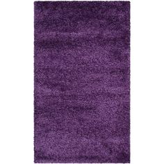 a purple rug on a white background with no one in the room to see it