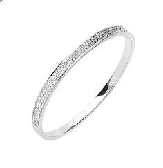 Strike sparkle and shine on wearing this glamorous Two Row Simulated Diamond CZ Oval Bangle Bracelet in Sterling Silver. It is beautifully crafted in sterling silver and is ideal to build an elegant look on when worn either standalone or as a stack piece around your wrist. This bangle bracelet is hypoallergenic and nickel free in nature. It is also well secured by a box clasp that offers safety and comfort when worn. The bangle is extremely elegant as it is only 3mm thick and 7.5 inches in circu Oval Bangle, Crochet Mat, Box Clasp, Shine On, In Nature, Bangle Bracelet, Diamond Bracelet, The Row, Cuff Bracelets