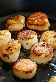 seared scallops cooking in a skillet