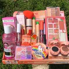 the contents of a pink makeup box are neatly organized and ready to be carried out