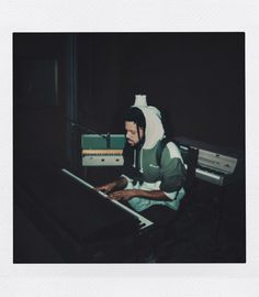 a man sitting in front of a keyboard