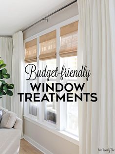 a living room filled with furniture and windows covered in white drapes, text reads budget - friendly window treatments