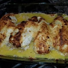 a casserole dish with chicken and cheese in it