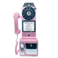 an old fashioned pink pay phone on a white background