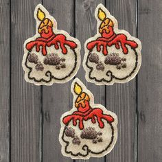 three patches with candles on them sitting next to each other