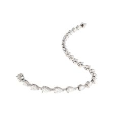 An absolutely stunning Pear Shaped Diamond tennis bracelet. This bracelet has an array of calibrated and matched Pear Shaped Diamonds with color grade of GH and clarity of VS which are beautifully prong set in Platinum with bars for 7''. The 25 diamonds total an amazing 3.85CTW in total. This bracelet is the utmost quality and a timeless addition to any jewelry collection. Diamond Tennis Bracelet, Color Grading, Tennis Bracelet Diamond, Pear Shaped Diamond, Tennis Bracelet, Pear Shaped, Prong Setting, Pear, Jewelry Collection