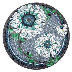 a glass plate with flowers painted on it